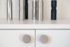 nice knobs in brushed stainless steel on kitchen cabinets