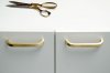 handel on your office furniture in brushed brass