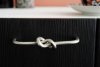 kitchen handle with knot in brushed nickel