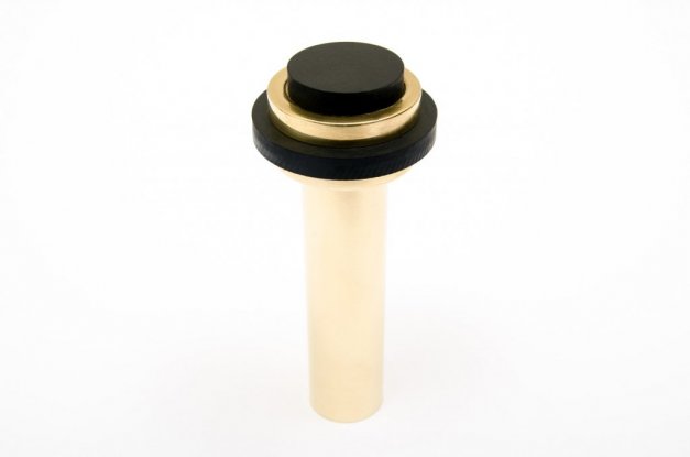 Fin dörrstopp i polerad mässing